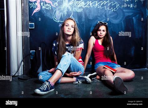 Two Young Women In A Bright Bedroom Slow... 